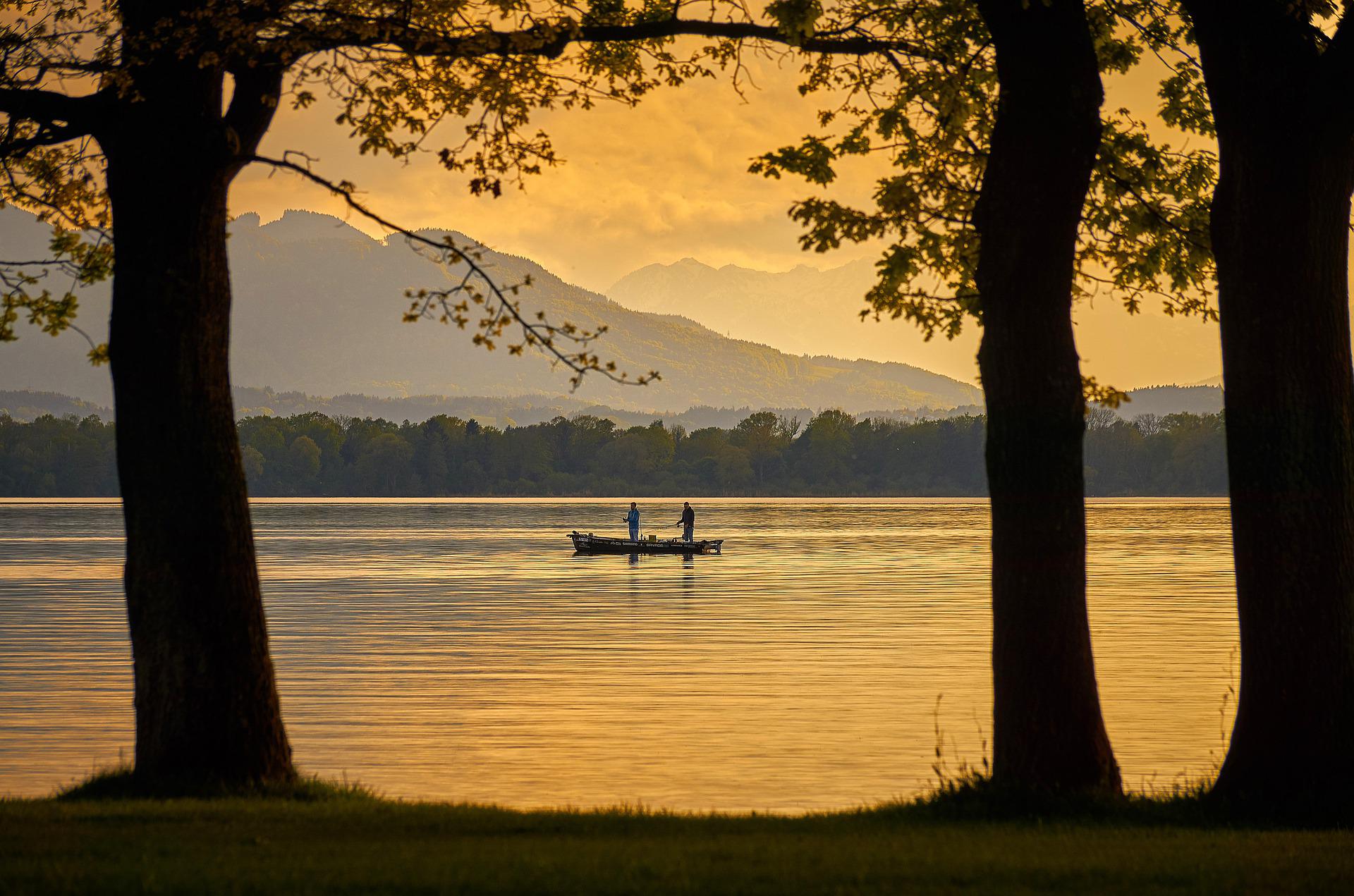 Two people fishing on a lake