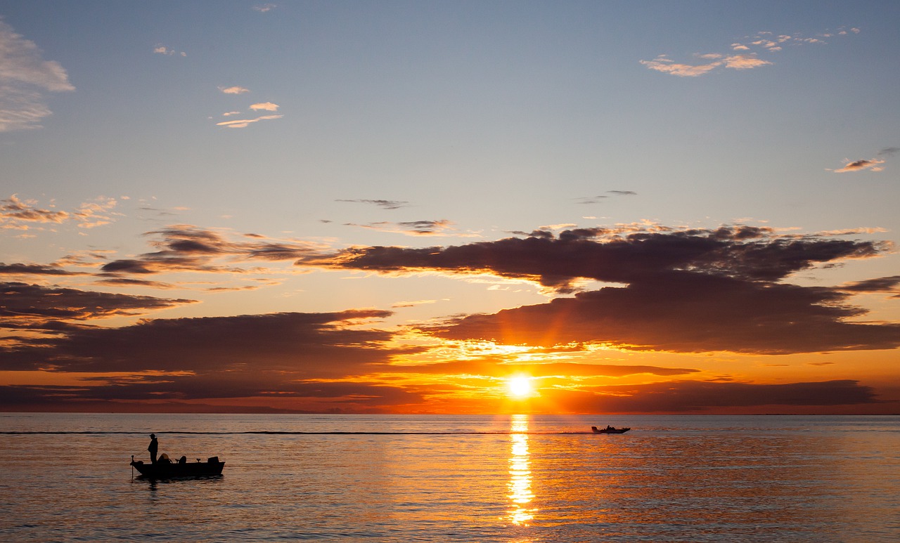 Fisherman fishing during sunset